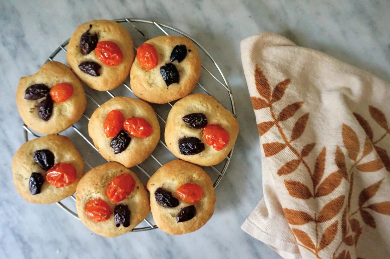 Mini focaccia with olives and tomatoes